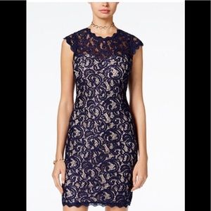 Navy blue form fitting sequin dress. Cap sleeves.